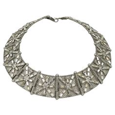 Jean Louis Scherrer Vintage Jewelled Art Deco Design Collar Necklace | See more rare vintage Choker Necklaces at https://www.1stdibs.com/jewelry/necklaces/choker-necklaces Vintage Luxury Chain Necklace For Evenings, Luxury Vintage Evening Chain Necklace, Vintage Long Costume Necklace, Cartier 1895 Necklace, Silver Art Deco Collectible Necklace, Jean Louis Scherrer, Necklaces Choker, Vintage Choker Necklace, Pearl Strands Necklace