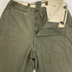 Vintage military work wear pants 1930-60s Size: 32" - 34" inseam-33” Vintage Wide-leg Cargo Jeans, Full Length Military Style Khaki Pants, Military Style Khaki Full-length Pants, Military Style Full-length Khaki Pants, Full Length Military Cotton Bottoms, Khaki Full-length Work Pants With Belt Loops, Military Style Wide Leg Cotton Work Pants, Military Style Cotton Pants With Welt Pockets, Military Style Wide Leg Pants With Belt Loops