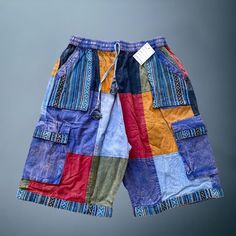 ummer antique looking boho patchwork shorts unisex xoxo bigger and breathable size multipockets 4 pockets Stylish eye catching design colorful patch Made from 100% organic cotton Antique looking handmade patchwork made in Nepal each shorts will have a different patchwork style but very similar to these pictures shown Multicolor Hippie Shorts For Vacation, Hippie Multicolor Shorts For The Beach, Hippie Multicolor Shorts For Beach, Hippie Multicolor Beach Shorts, Bohemian Cotton Bottoms With Patchwork, Bohemian Harem Pants With Pockets For Vacation, Bohemian Bottoms With Pockets For Vacation, Hippie Summer Patchwork Pants, Summer Hippie Patchwork Pants