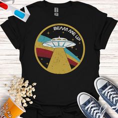 a t - shirt that says beam me up with an image of a flying saucer