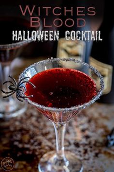 a halloween cocktail in a martini glass with the words, witches blood written on it