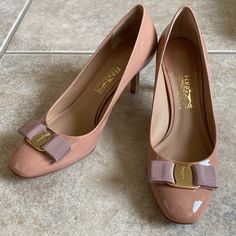 Authentic Ferragamo Heels In Excellent Condition. Only Worn Once To An Event, Visible Areas When Wearing Look Brand New. No Scratches On Outside Or On Hardware. Leather Insoles Look Brand New. See Photos For Some Wear And Tear On Soles And Video For Slightly Misaligned Heel Point On Left Shoe (Easily Fixable). Heel Is 7cm. Patent Leather In Nude Pink/Peach Color. Signature Ferragamo Bow. Made In Italy. Style And Color No Longer Sold By Designer. Comes With Original Box, Tissue Paper Inside Box, Feminine Leather Closed Toe Court Shoes, Pink Low Heel Workwear Heels, Luxury Spring Court Shoes With Low Heel, Leather Sole Heels For Galas, Luxury Pink Calf Leather Heels, Pink Padded Heel Court Shoes For Office, Pink Ankle Strap Court Shoes For Formal Occasions, Elegant Pink Court Shoes With 4-inch Heel, Feminine Formal Heels With Round Toe