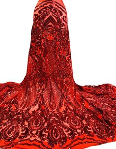 a red dress with an intricate pattern on it