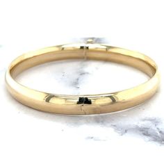 Women's 14k Yellow Gold 5 Mm Wide Box Clasp 8-Inch Bangle Minimalist Bracelet. Handmade Item Materials: Gold Style: Minimalist Can Be Personalised Bracelet Width: 5 Millimetres; Bracelet Length: 8 Inches Material: 14k Yellow Gold Closure: Box Solid / Hollow: Hollow Weights: 5mm - 8" - 5.3 Gram Formal 14k Gold Bracelet, Elegant 14k Gold Stamped Bangle, Elegant 14k Stamped Round Bangle, Elegant 14k Stamped Bangle, Classic Adjustable Gold Bracelet, Classic Adjustable Gold Bracelet With Polished Finish, Classic Stackable Jewelry For Formal Occasions, Classic Everyday 14k Gold Bracelet, Classic Formal Jewelry With Smooth Finish