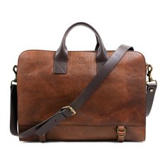 "DESIGN - A full-grain Italian leather briefcase Wide Sargasso Sea is your new favorite companion to school or work. Three spacious compartments accommodate plenty of documents and folders, a laptop and so much more. Two adjustable straps on the bottom not only provide extra support but also allow to adjust the size of the briefcase. Comfortable carrying by hand, it also has a detachable shoulder strap for a hands-free experience. We offer laser engraving services! Please choose one of the fonts Classic School Bag With Waxed Finish, Classic Waxed Finish School Bag, Classic Brown Briefcase For Everyday Use, Classic Brown Everyday Briefcase, Brown Leather Briefcase For Daily Use, Classic Brown Laptop Bag With Waxed Finish, Brown Cases With Luggage Sleeve For Everyday Use, Brown Waxed Finish Satchel For Office, Brown Waxed Finish Shoulder Bag For Office