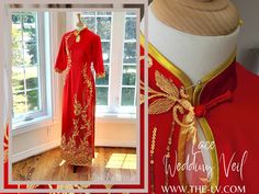 a red and gold wedding gown on display in front of a window