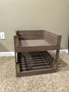 a wooden shelf sitting on top of a carpeted floor