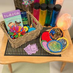 a table with books and craft supplies on it