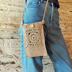 The Crochet Mobile Phone Bag is perfect for walking and will add style to any outfit!  This unique accessory combines a fashionable design and a size that fits everything you need. --------------------------------------- More crochet bags: https://www.etsy.com/shop/LengoKnitStudio?section_id=38573283 --------------------------------------- Bag Sizes (approximately): Width: 13 cm (5.1 inches), Height: 20 cm (7.8 inches),             Strap length: 122 cm (48 inches). Details: * Comp: 72% Cotton, 1 Casual Beige Square Phone Bag, Casual Crochet Travel Bag For Mobile Phone, Casual Crochet Bag For On-the-go, Square Phone Bag For Daily Use In Summer, Handmade Beige Shoulder Bag For On-the-go, Square Phone Bag For Everyday Use In Summer, Beige Crochet Mobile Phone Bag For Travel, Casual Rectangular Crochet Bag For On-the-go, Casual Crochet Pouch Shoulder Bag