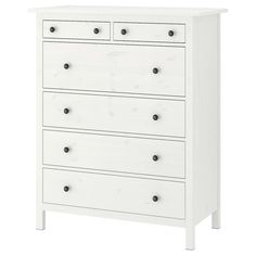 a white dresser with four drawers and black knobs on the bottom drawer, against a white background