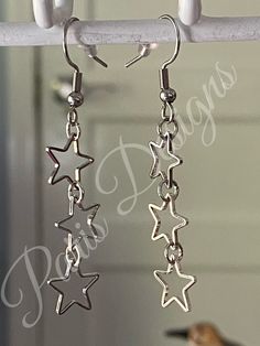 These dainty star earrings are so chic! They are made of hypoallergenic Stainless Steel and antique silver. These earrings can make the perfect gift for a loved one or to keep for yourself  Earring: Hypoallergenic solid Stainless Steel (Fishhook, open eye rings, jump rings.)  Antique Silver: (Stars) Care: Stainless Steel is a highly durable metal that can withstand the wear and tear of everyday activities and can even be worn in the shower; it won't tarnish, scratch, or rust ٩｡)۶ However, the an Star Accessories, Eye Rings, Stars Earrings, Rings Antique, Jewelry Accessories Ideas, Paris Design, Funky Jewelry, Star Jewelry, Eye Ring