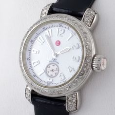 Michele Stainless Steel Diamond CSX Quartz Women's Watch w/ Leather Band Movement #Ronda 1064 Case #MW03A0.84 Model #MW03A01A2025 Total Diamond Weight = 0.50 ct (84 diamonds) Stainless Steel Case w/ Diamond Accents 25 mm in Diameter (29 mm w/ Crown) Lug-to-Lug Distance = 33 mm Long Lug-to-Lug Width = 12 mm Thickness = 7 mm Enamel on crown is cracked. See photos for details. Mother-of-Pearl guilloche dial w/ Silver Numbers and Luminous Hands (M + H) Includes Seconds Subdial at 6:00 20 mm in Diame Classic Round Diamond Analog Watch, Classic Analog Diamond Watch, White Gold Analog Diamond Watch, White Round Analog Diamond Watch, White Analog Diamond Watch, Round Analog Watch Accessories For Anniversary, Michele Watches, Silver Numbers, Women's Watch