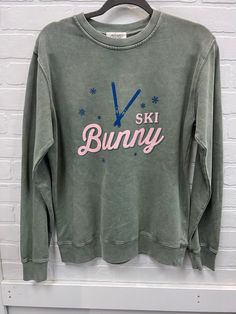 Stay warm and look extra cute with the Ski Bunny Sweatshirt! Featuring a fuzzy bunny logo, this sweater is sure to turn heads and snuggle you with comfort! Perfect for après-ski festivities, you'll be toute belle while showing your love of winter sports. So grab yours now and get ready to hoppin'! Comfy Crew Sweater For Winter, Casual Crew Neck Sweater For Ski Season, Fun Winter Sweatshirt With Letter Print, Super Soft Casual Winter Sweatshirt, Casual Super Soft Winter Sweatshirt, Sporty Super Soft Winter Sweatshirt, Casual Super Soft Sweatshirt For Winter, Casual Tops For Winter Sports, Comfy Crew Neck Winter Tops