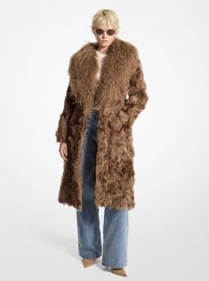 Feel like pure luxury in this 100% shearling coat. With a knee-length silhouette and an oversized shag collar, it delivers instant opulence—and a touch of vintage glamour—to both day and evening looks. Luxury Fall Fur Coat With Faux Fur Trim, Luxury Fur Coat With Faux Fur Trim For Fall, Luxury Fur Coat For Formal Occasions In Fall, Luxury Formal Fur Coat For Fall, Luxury Formal Fall Fur Coat, Chic Sheepskin Coat With Faux Fur Lining, Chic Sheepskin Fur Coat With Faux Fur Lining, Luxury Shearling Fur Coat For Fall, Elegant Fur Coat With Faux Fur Trim For Fall