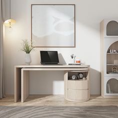 a laptop computer sitting on top of a wooden desk next to a white vase and bookcase