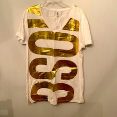 Nwt Moschino Swim T-Shirt Gold T-shirt With Letter Print For Summer, Gold Cotton Tops With Logo Print, Casual Gold T-shirt With Logo Print, Casual Gold T-shirt For Summer, Gold Letter Print Top For Summer, Gold Letter Print Tops For Summer, Casual Gold T-shirt With Screen Print, Gold Casual T-shirt With Screen Print, Spring Gold Graphic Print T-shirt