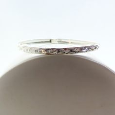 This vintage Jacmel rounded sterling bracelet has a delicate etched pattern all around the bracelet.  Marked with 925 JCM. The bracelet is in excellent condition for having been previously owned with little to no signs of wear. There may be some very light tarnish which could be removed with further cleaning. But I will clean the item again prior to shipping. 7 1/2" inside edge to edge 3/16" wide Shipping is only to US addresses at this time and via USPS Ground Advantage. You will be provided a tracking number and an estimated date of delivery. **Shipping is upgraded to Priority Mail when 2 or more items are combined or order exceeds $75.** PLEASE NOTE: Please read the listing carefully and proceed cautiously. I accept returns, however, although shipping costs are initially free I deduct t Classic Round Bangle Stamped 925, Sterling Silver Etched Bracelets For Anniversary, Etched Sterling Silver Bracelet For Wedding, Classic Etched Sterling Silver Bracelet As Gift, Classic Etched Sterling Silver Bracelet, Etched Sterling Silver Bracelet For Formal Occasions, Etched Sterling Silver Bracelet As Gift, Formal Etched Sterling Silver Bracelet, Etched Sterling Silver Bracelet Gift