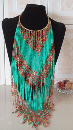 African Beaded Fringe Necklace, Multistrand Necklace, Beaded Jewelry, Women Jewelry, Tribal Necklace, African Jewelry, Gift For HerThis statement necklace is superbly crafted which makes you stand out.Main color - turquoise green.Closure: hookAvailable in different colors, please contact me.Neck width: 17 inchesFringe width 16 inches3-5 days delivery via DHL ExpressColors of your choice can be customized,please contact me.Feel free to send me a convo or e-mail for any clarification or more infor Green Multi-strand Beaded Necklace For Festival, Green Multi-strand Beaded Necklaces For Festivals, Colorful Beads Multi-strand Bib Necklaces For Jewelry Making, Colorful Beads Multi-strand Bib Necklace For Jewelry Making, Green Multi-strand Festival Necklaces, Traditional Green Multi-strand Beaded Necklaces, Bohemian Bib Necklace With Polished Beads As Gift, Multi-strand Beaded Necklace With Dangling Beads For Gift, Multi-strand Dangling Beads For Gift