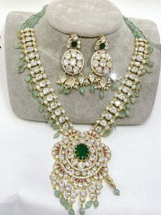 Kundanjewelsbyshiv Indian Ethnic Polki Kundan Golden Set With 22 Carat Gold Plated Necklace Set * This Set Is made up with High Quality Polki Kundan * Gold Plating Is used * High Quality Drops  Are used * Set includes Double Layered Necklace and earrings *Necklace Length Is Adjustable With Back Chain/Cord Earrings Have Pushbacks We made Jewelry in pachi kundan /Ahemdabadi kundan/ Polki Kundan and made designs on order only , need at least 25 days to make ,to do customization as they are acceptab Cord Earrings, Kundan Necklace Set, Necklace Set Indian, 22 Carat Gold, Kundan Necklace, Semi Precious Jewelry, Kundan Necklaces, Necklace Long, Layered Necklace