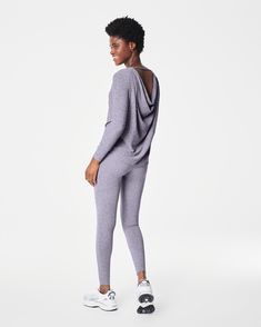 Our cozy, peachy-soft high-rise leggings feature a built-in waistband that gently smooths your curves with light core compression—plus an adjustable tunnel drawstring for the perfect fit. Made with super-soft fabric with 4-way stretch in a heathered, tonal design, these leggings are enhanced with strategically placed and engineered back-v-seaming that defines the booty. The result? A look that suits low-impact movement and just-as-easygoing outings.​ | Spanx Women's SPANXsmooth SoftStretch High-Rise Leggings Versatile Full-length Activewear For Loungewear, Versatile Activewear For Pilates In Fall, Versatile Fall Activewear For Pilates, Compressive Athleisure Leggings For Loungewear, 4-way Stretch Yoga Pants For Fall Loungewear, Functional 4-way Stretch Yoga Pants For Loungewear, Versatile Activewear For Fall, High Stretch Activewear With Thumbholes For Loungewear, Fall Athleisure Yoga Pants For Pilates