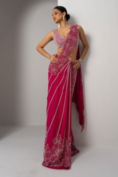 Pink pre-draped saree with floret, stripe hand embroidery using beads. Paired with a blouse with all over beaded cluster embroidery. - Aza Fashions Pre-draped Georgette Saree With Zari Work, Evening Sleeveless Pre-draped Saree With Cutdana, Festive Pre-draped Georgette Saree, Pre-draped Floor-length Saree With Zari Work, Sleeveless Pre-draped Saree With Sheer Dupatta For Diwali, Evening Pre-draped Saree For Navratri, Pre-draped Saree With Dupatta For Reception, Elegant Pre-draped Saree For Festivals, Elegant Pink Pre-draped Saree For Navratri