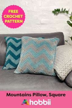 a couch with two pillows on it and the text free crochet pattern mountains pillow, square