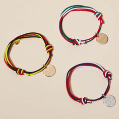 Wave your flag as you wear our Personalized Olympic Bracelet. A colorful way to represent your country, choose three colors of bracelet braid to create your chosen flag of the world. This personalized bracelet can be made even more special with a hand-engraved name, date, or word on the front and reverse of the shiny disc charm.&nbsp;18K Champagne Gold Plated, 925 Sterling Silver or 18K Rose Gold PlatedPastille charm: 0.6” x 0.6”Braid made of durable, colorfast polyesterFully adjustable slid Crystal Dice, Personalised Bracelet, Personalized Bracelet, Grandmother Gifts, Crystal Stars, Sliding Knot, Flags Of The World, Champagne Gold, Gifts For New Moms