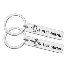 two metal key chains that say best friend and she's best friend