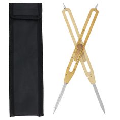 a pair of scissors sitting next to a black bag with a ruler on it's side