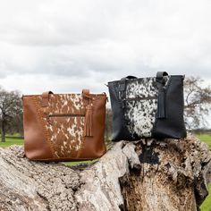 Designed for urban and western cowgirls alike, functionality and beauty collide in the Indy Carryall. We created this tote to move with you through all phases of cowgirlhood, from the baby-makin' years to work life, traveling, and beyond. Featuring structured leather and the best handpicked cowhides, this carryall has the versatility to be worn as a backpack or a tote. The roomy interior lets you keep bottles (or beer!) cold or warm, with enough pockets to fit all your essentials. Outside, you’l Western Style Brown Bag For Fall, Western Leather Bags For Fall, Western Brown Bags For Fall, Country Style Brown Bag For Everyday Use, Western Style Leather Shoulder Bag For Everyday Use, Western Style Satchel Bag For Travel, Western Leather Shoulder Bag For Everyday Use, Brown Leather Bags For Rodeo, Western Style Brown Bags For Rodeo