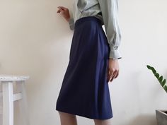 "Vintage MISSONI Donna Navy Blue Straight Skirt - 50% Wool 50% Viscose fabric - Nylon zipper up back - Fixed waist - Fully lined - Made in Italy - Very good vintage condition Measurements : Waist : 27\" Hips : 39\" Total length : 24.5\" Model height : 5'6\" bust : 33\" waist : 25\" hips : 35\" Please read the policies tab before purchase. I can't have a model for clothes of all sizes, but I have already clearly written a model size. If you have questions about the size, picture, or others, pleas Fitted Blue Elegant Wrap Skirt, Blue Knee-length Pencil Skirt For Summer, Elegant Blue Wrap Skirt, Elegant Blue Stretch Skirt, Blue Workwear Skirt For Summer, Blue Skirt For Summer Workwear, Blue Summer Workwear Skirt, Blue Pleated Mini Skirt For Work, Blue Summer Skirt For Work