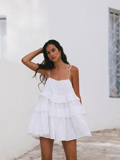 Elevate your summer wardrobe with this stunning women's layered ruffle mini dress. Designed with a backless spaghetti strap style, this 100% cotton dress offers both comfort and elegance. Its versatile design makes it a perfect choice for various occasions, from festive events to everyday wear. Key Features: Premium Fabric: Made from 100% cotton, ensuring a soft, breathable, and comfortable feel against the skin. Chic Design: Features multiple layers of ruffles, creating a playful yet sophistica Loose Summer Dress, Summer Layers, Beach Vacations, Backless Design, Ruffle Mini Dress, Pink Mini Dresses, Loose Dress, Sleeveless Mini Dress, Daily Activities