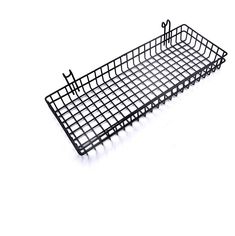 a wire basket with scissors on it sitting on a white surface in the shape of a rectangle