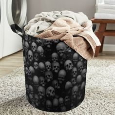 a laundry basket filled with skulls on top of a rug