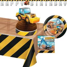 a construction themed birthday party set up with plates, napkins and tablecloths