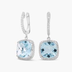 The serene hues of cushion-cut aquamarine are brightened by dazzling halos of round-cut diamonds on these 14k white gold earrings. Additional diamonds trail up the front hoop of the lever backing. Precious Gemstones Jewelry, Aquamarine Earrings, White Gold Earrings, Diamond Halo, Round Cut Diamond, Cushion Cut, Halo Diamond, Semi Precious Gemstones, Gemstone Earrings