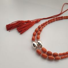 < Red natural coral necklace with silvered brass beads > The product is made according to the model of authentic Ukrainian jewelry. The coral is natural, from the bottom of the Pacific Ocean. The ties are made of silk fabrics. They are pleasing to the body and make your look intresting even from behind. > Necklace's length the first string - 31 cm (12,2 in) > Necklace weight - 42 grams Coral Jewelry Vintage, Ukrainian Jewelry, Red Coral Jewellery, Coral Jewelry Set, Vintage Style Necklace, Coral Beads Necklace, Necklace Orange, Coral Gemstone, Silk Fabrics