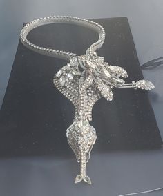 "This is a great looking silver-plated with clear crystal Snake necklace signed Ken Morrison 32\" long x 3 312\" wide   excellent condition." Silver Diamond Long Necklace, Luxury Silver Necklace For Evening, Luxury Rhinestone Metal Necklace, Silver Snake Chain Jewelry For Party, Silver Luxury Rhinestone Necklace For Weddings, Luxury Silver Rhinestone Necklace For Wedding, Evening Rhinestone Pendant Necklace, Elegant Evening Jewelry With Handset Stones, Silver Long Necklace For Formal Occasions