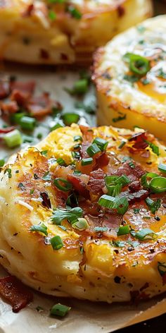 baked potatoes with bacon and green onions on a plate