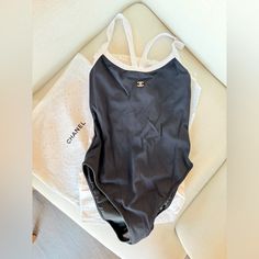 This Is One Of The Most Highly Coveted Chanel Pieces Made In The Last 5 Years. The Simplicity Makes This Suit A Timeless Staple. It Can Also Easily Be Worn As A Bodysuit. It Is Brand New, Never Worn, With The Sticker Still In Tact In The Crotch Area. Tags Are Attached, And It Comes Nicely Wrapped In A Chanel Dustbag. Size 36, Fits True To Size. Get It Before It Goes!!! Reasonable Offers Welcome Chanel Bodysuit, Body Suit, Womens Swim, Bathing Suits, Swimming, Chanel, One Piece, Brand New, Things To Come