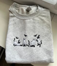 I Made it with love ❤️ Product Material: -8 oz., 50% cotton, 50% polyester -I do not accept returns unless items are damaged. Every one of my crewnecks/hoodies is made to order and customized just for you. Please feel free to contact me if you have any problems,questions or concerns. Due to lighting, phone screens, or monitor settings, colors may be slightly off.  Ps the design is 5 by 7  THANK YOU ❤️🥰 Spooky Cats, Embroidery Crewneck, Cat Embroidery, Best Christmas Presents, Embroidery Monogram, Phone Screens, Embroidered Crewneck, 5 To 7, I Made It