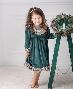 ♡ This is handmade and unique girl dress below knee-length and with long sleeves.  ♡ MADE OF: Green velvet with gold lace. The lining is made of 100% cotton ♡ Processing time: 7-10 business days ♡ CARE INSTRUCTIONS: Wash in cold or warm water (30oC/ 65 - 85F). Do not use bleach. Dry at low temperatures, do not use machine drying. Iron at medium or low temperature. Hand wash and hang dry for longer wear. Gold Long Sleeve Dress For Winter, Gold Long Sleeve Winter Dress, Green Lace Trim Dress For Fall, Vintage Green Winter Dresses, Green Vintage Winter Dress, Green Holiday Dress For Fall, Green Holiday Dresses For Fall, Green Long Sleeve Festive Dress, Green Long Sleeve Dress For Holiday