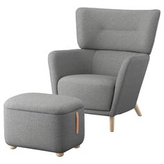 a grey chair and ottoman with wooden legs