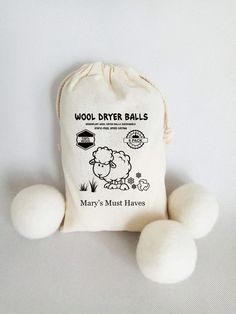 three wool dryer balls sitting next to each other on a white surface with the words mary's must haves printed on it