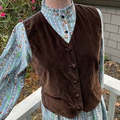 Retro Brown Lightweight Velvet Button Down Vest. Vintage Brand Is Joan Leslie From 80’s Wear Under A Sports Jacket Or Over A Dress. Wear It Open Or Buttoned Up. Has Western And Bohemian Vibes. Front Is Velvet Cotton And Back Is Polyester. Back Has An Adjustable Tie, See Photo. Has 2 Real(Unopened) Front Pockets. Note: Teal Dress And Beige Coat Are Also In Out Store. Size Is Small Petite, Sp Measures Flat & Closed. Pit To Pit 19” Waist 18” Length 22” We Love Offers! Stored With Vests Tags: Winter Joan Leslie, Boho Vest, Bohemian Vibes, Beige Coat, Teal Dress, Western Boho, Down Vest, Vintage Branding, Sports Jacket