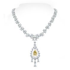 With a yellow pear shape diamond at its center, the Amaya necklace is all about delicacy and oomph. The marquise and pear diamonds weaving around the neck are elegant and sensual. This stunning piece can be worn with or without the pendant to add to its versatility and allure. Diamonds Shapes: Pear Shape, Marquise, Emerald & Round Center Solitaire: 2.60 ct Fancy Yellow Pear ShapeTotal Diamonds Weight: 22.45 ctDiamonds Color: G - H Diamonds Clarity: VS - SI (Very Slightly Included - Slightly Incl Marquise Diamond Pendant, Marquise Diamond Necklace, Yellow Diamond Jewelry, Bridal Diamond Necklace, Diamond Weave, Diamond Jewelry Designs, Expensive Jewelry, Fancy Jewelry, Marquise Diamond