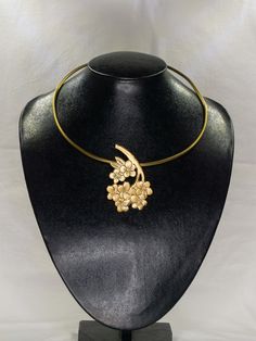 This is such a fabulous modern brass necklace! it is carved by hand andbgold-colored with peach blossom shape, but simple trinkets are still a hinkcker. ►Handcrafted from 100% pure brass by Vietnam skilled craftsman. It is soldered together using hand-engraved, hammered, textured and gently polished. Due to the simplicity, these earrings are perfect for impressive outfit or can be a special gift for friends, family, business partner on any special occasions. These hairpins are perfect for impres Gold Choker With Flower Charm, Elegant Gold Flower Choker, Elegant Brass Necklaces With Flower Charm, Elegant Brass Necklace With Flower Charm, Gold Brass Necklace With Flower Charm, Bronze Brass Necklace With Flower Pendant, Gold Necklace With Flower Charm In Brass, Unique Brass Flower-shaped Jewelry, Gold Flower Choker As Gift