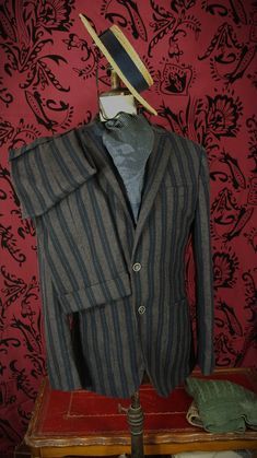 More items at www.newfanglednatty.com A good quality Italian suit by a well respected and expensive tailor. The suit is in an interesting unusual style , with the turn upped and pleated trousers and striped cloth. Looks rather vintage European in style. Half lined jacket. Lovely tailoring , design and materials as you would expect from a vintage Aquascutum suit. RRP £695  -   Label says 44 R.  Fits as a 42 inch large slimmer 44 inch large, 36 inch  waist and 31 inside leg . See measurements below. Condition: Very light use. . Approximate sizes when laid flat Please check the measurements to a similar garment that you own to ensure a good fit.    Underarm to underarm:- 23"     Middle across jacket waist:- 21 3/4"                                           Underarm to hem:- 20 " Fitted Winter Suits With Welt Pockets, Fitted Winter Suits For Tailoring, Fitted Single Button Winter Suit, Winter Fitted Three-piece Suit For Formal Occasions, Fitted Brown Suit With Pockets, Classic Fitted Three-piece Suit For Winter, Classic Fitted Three-piece Winter Suit, Fitted Notch Lapel Sets For Winter, Brown Fitted Three-piece Suit For Winter