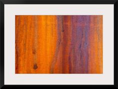 an orange and purple painting with black frame