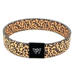 "Accessorize with our popular Leopard print band. Available sizes:  Extra Small 5.5\" (petites + kids) Small 6.5\" (most common fitting size) Medium 7.5\" (large wrists) Large or Anklet 8.5\" (very large wrists or anklet) 1/2\" Width Reversible surf and beachy prints. Elastic blend material, can stretch to desired fit. Packaged in natural drawstring gift pouches. Machine washable. Chlorine and saltwater safe." Brown Bracelets For Summer Festival, Trendy Black Band Bracelets, Casual Everyday Wristband With Bracelet Style, Casual Black Band Bracelet, Casual Black Wristband, Adjustable Band Bracelet Casual Style, Adjustable Black Band Bracelet For Festivals, Adjustable Band Bracelet, Adjustable Casual Band Bracelet